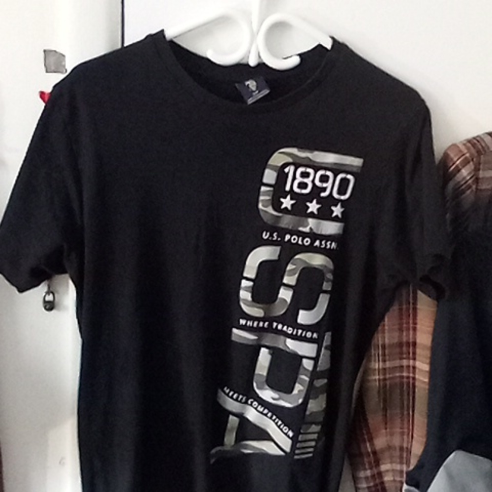 U.S Polo Assn 1890 size small color black camo tan in the letters DOPE tee